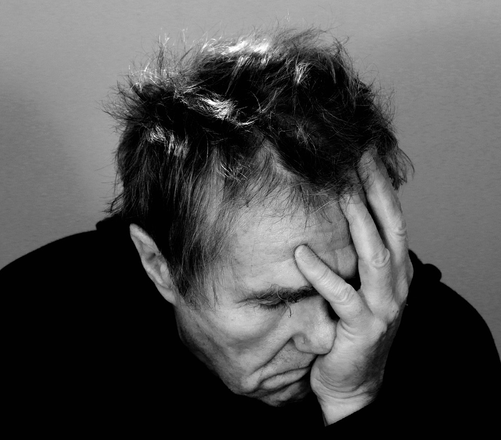 Man worried about job and food security.