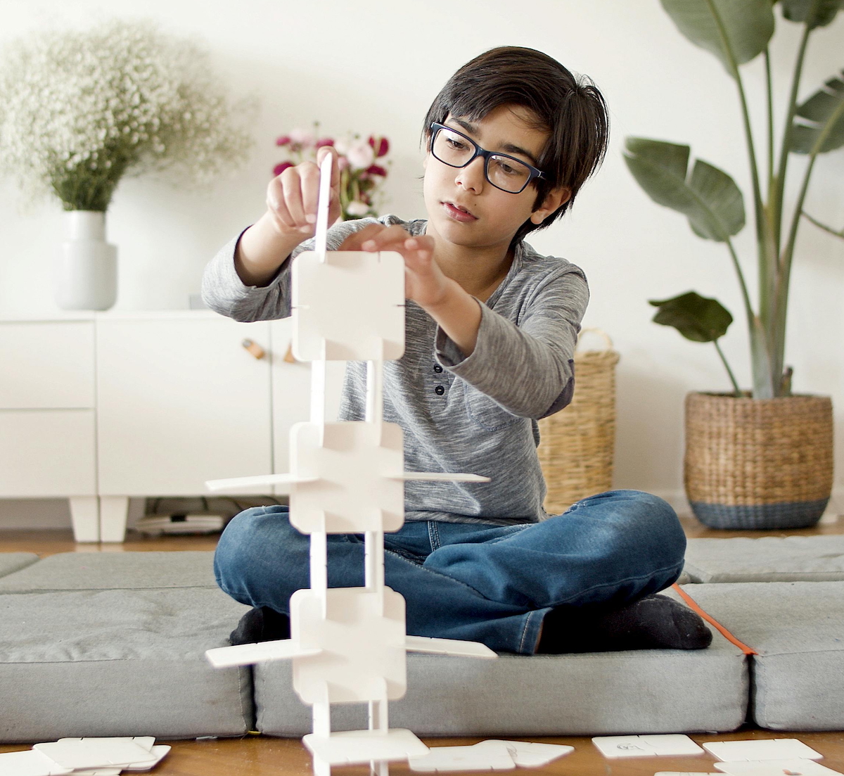A neurodivergent child with autism, hyper focused on his activity.